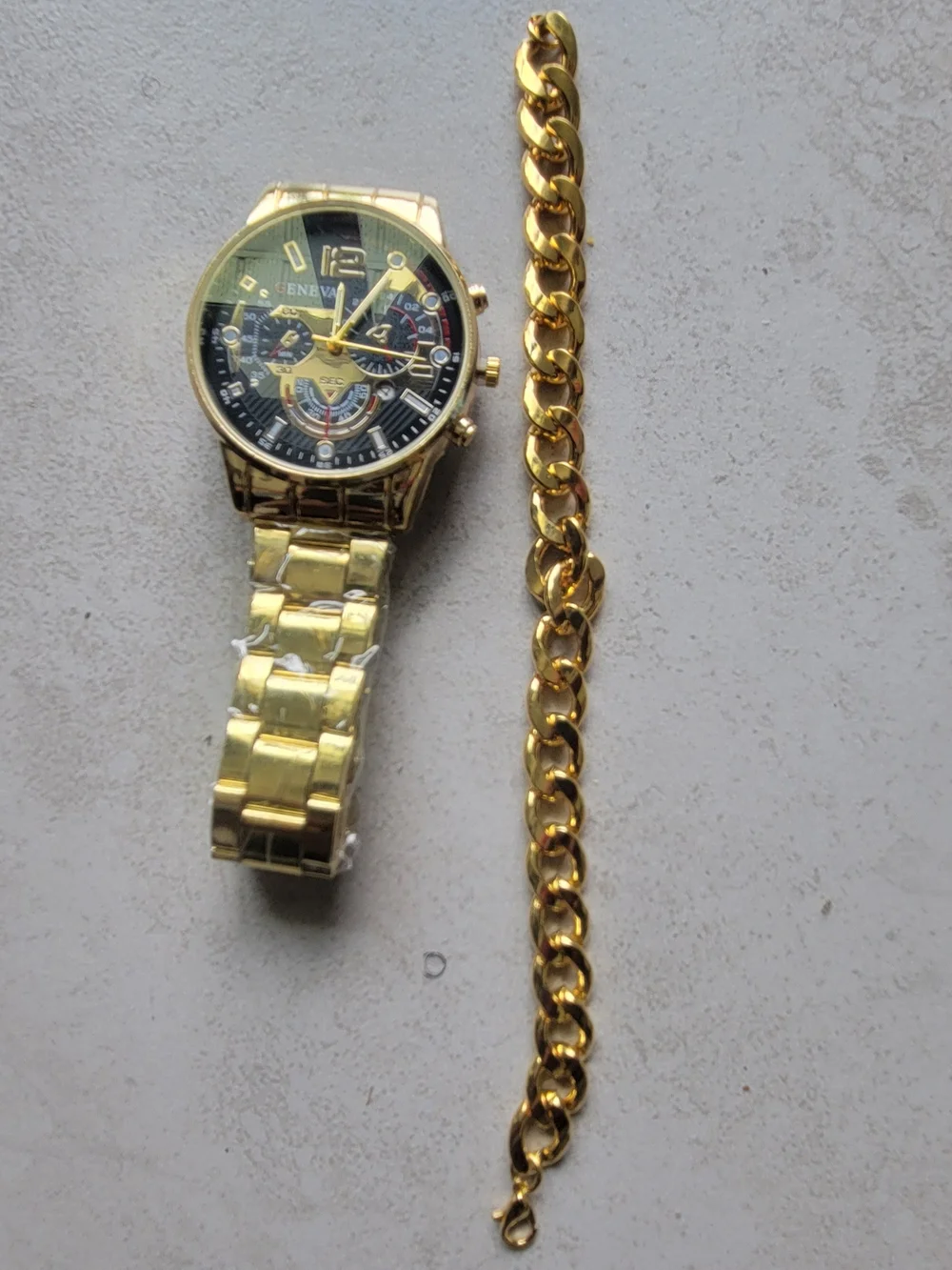 Geneva Mens Gold watch with matching 7